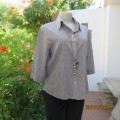 Cool light grey/black check button down/shirt collar top in rayon. Size 38.Elbow length sleeves.
