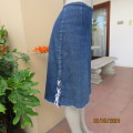 Chic blue denim jean skirt. Stretch polycotton. Bandless/Back zip. Low side seam braiding. Size 38.