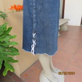 Chic blue denim jean skirt. Stretch polycotton. Bandless/Back zip. Low side seam braiding. Size 38.