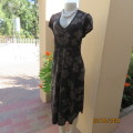 Fabulous black/graphic bold cream floral pattern elasticated empire dress.By REITMANS Canada size 40