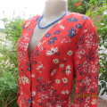 Make a statement. Apple red cream/blue floral long sleeve viscose top.Peplum/V neck. By H&M size 38