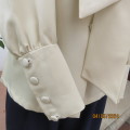 Smart rich cream 100% firm polyester long sleeve top/ Tie collar/Covered front buttons. Size 36.