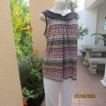 Lovely cool graphic printed top in pink/turquoise/yellow with rounded black yoke neckline.Size 40
