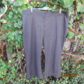 Smart grey/black mottled polyrayon stretch size 46 pants. Two tiny front pockets. WOOLWORTHS.