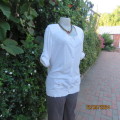 Soft cream cotton/rayon knit button down top. Scooped neckline. Elbow roll up sleeves.By TRU size 38