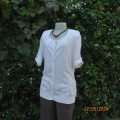 Soft cream cotton/rayon knit button down top. Scooped neckline. Elbow roll up sleeves.By TRU size 38