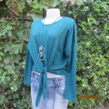 Pretty soft warm acrylic knit long sleeve  top with stretch. Straps to tie on front. Size 38. As new