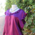 Striking silky soft, shiny polyester stretch blouson top in purple. By RENE TAYLOR size 40/16.