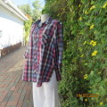 Check it out!! Checked pink/blue/black shirt with elbow length sleeves. Two front pockets. Size 42.