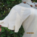 Unique rich cream viscose stretch  top. By ANOTHER EDITION size 38. Wide diagonal inside seams.