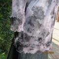 Sheer stretch poly coverup in grey floral colours. Size 36 by EVES  LEAVES. Open front/tiestrings.