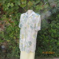 Tastefully printed extra long short sleeve top in shades of green/lilac accents. Size 42. As new.