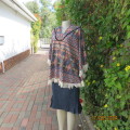 Warm,cosy hooded stretch polyester halfmoon top in colourful graphic pattern. Size 38/40.As new.