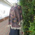 Warm,cosy hooded stretch polyester halfmoon top in colourful graphic pattern. Size 38/40.As new.