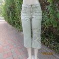 Well known PAPAYA cropped fern green 100% cotton pants. Size 33/9. Embroidered floral design on leg.