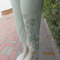 Well known PAPAYA cropped fern green 100% cotton pants. Size 33/9. Embroidered floral design on leg.