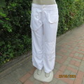 Top of the range white polyester straight legged pants by NINE to SIX  L.A. size 40. Pockets galore.