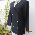 Elegant double breast black viscose/polyester long sleeve all seasons jacket. Size 36 by WOOLWORTHS.