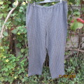 Warm black/grey check pants 70cm inner leg. Elasticated waist. Size 46/22. Owner made.Very good cond