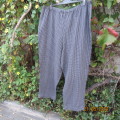 Warm black/grey check pants 70cm inner leg. Elasticated waist. Size 46/22. Owner made.Very good cond