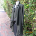 Well-cut hunters green long wool cape with mustard/red accents.Genuine leather corners.Size 34 to 38