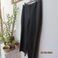 Stunning dress pants in black polyester with vague grey check. By ZETA size 44/20. Brand new cond.