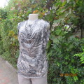 Glamour shiny top in cream/black/grey animal print. Stretch polyester.Cowl neckline.By OASIS size 40