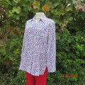 Classic white 100% polyester long sleeve top with red/blue/black pattern top. Size 38. New condition