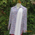 Classic white 100% polyester long sleeve top with red/blue/black pattern top. Size 38. New condition