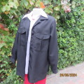 Versatile black jacket with long cuffed sleeves. In textured polyester.Front pockets. Size 38.As new