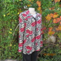 Beautiful top in animal print/red bold flowers on cream size 40. Long sleeves.Shirt collar. As new.