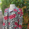 Beautiful top in animal print/red bold flowers on cream size 40. Long sleeves.Shirt collar. As new.