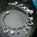 Silver whimsical charm bracelet  .. low WEEKEND shipping special