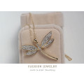Gold dragonfly pendant with swarovski elements.. Free chain