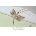 Gold dragonfly pendant with swarovski elements.. Free chain