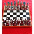 VINTAGE SOLID HEAVY LEAD CHESS PIECES ON CERAMIC BOARD CHESS SET.