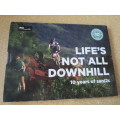 NOT ALL DOWNHILL  10 years of sani2c  (Mountain bikers) (In slipcase)