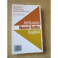 DIE KORT DRIETALIGE WOORDEBOEK: Afrikaans, N-Sotho and English  deur G. M. Grobler