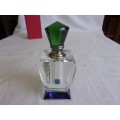 Lovely boxed faceted perfume bottle with green lid
