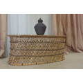 A BEAUTIFULLY MADE OVAL WICKER CENTRE/ OCCASIONAL TABLE WITH CONTRAST STITCH DETAILING