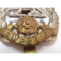 A WW1 HAMPSHIRE (ROSE) REGIMENT CAP BADGE.