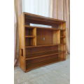 A BEAUTIFUL AND SOLIDLY MADE ORIENTAL TEAK BOOK CASE WITH AMPLE SHELVES AND STORAGE PIGEON HOLES