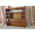 A BEAUTIFUL AND SOLIDLY MADE ORIENTAL TEAK BOOK CASE WITH AMPLE SHELVES AND STORAGE PIGEON HOLES