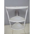 A LOVELY PLASTIC CORNER STAND (OR PLANT STAND)! VERY VERSATILE AROUND THE HOME!!