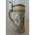 A SUPERB AUTHENTIC GERMAN 1/2 LITRE STONEWARE BEER STEIN WITH A DOMED PEWTER LID