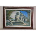 A FABULOUS LARGE FRAMED OIL ON BOARD PAINTING OF A MEDITERRANEAN VILLAGE WITH A LARGE FOUNTAIN