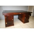 A STUNNING LARGE INDONESIAN TEAK EXECUTIVE "PARTNER" DESK WITH BRASS HANDLES AND HINGES