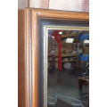A BEAUTIFUL DARK WOODEN FRAMED BEVELED GLASS MIRROR WITH GOLD GILDING, GORGEOUS FOR ANY HOME