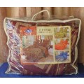 A BEAUTIFUL FIVE PIECE COMFORTER SET WITH  A RED AND GOLD PATTERN IN ITS ORIGINAL BAG