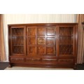A SUPERB VINTAGE SHOWCASE/ ENTERTAINMENT UNIT WITH INCREDIBLE WALNUT PANELLING AND CARVED ROSETTE